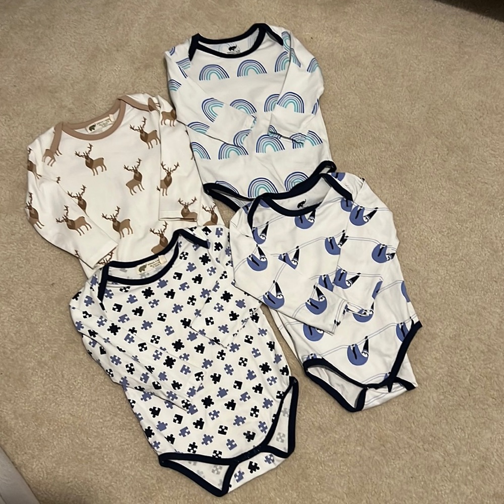 Four Monica and Andy bodysuits